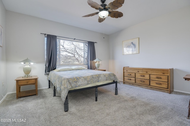 carpeted bedroom featuring a ceiling fan and baseboards