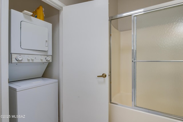 laundry area featuring laundry area and stacked washer and clothes dryer