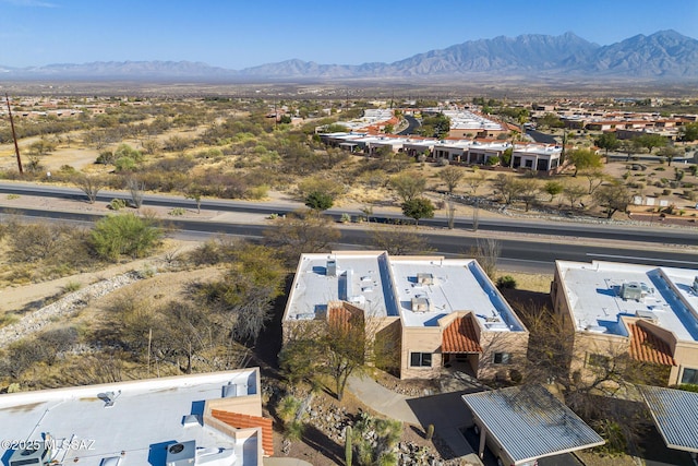 drone / aerial view featuring a mountain view