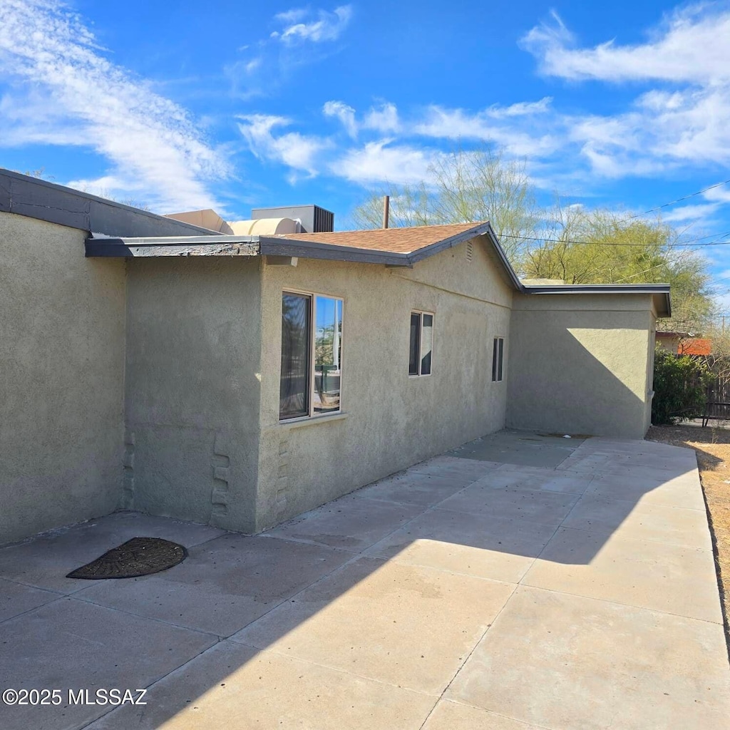 view of home's exterior with a patio and stucco siding