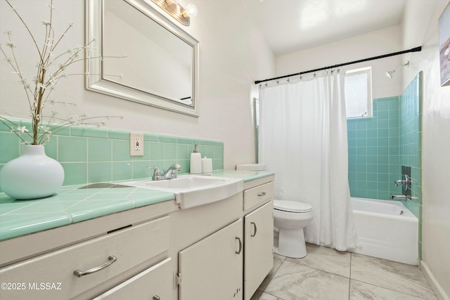 full bathroom with marble finish floor, tasteful backsplash, toilet, shower / bath combo with shower curtain, and vanity