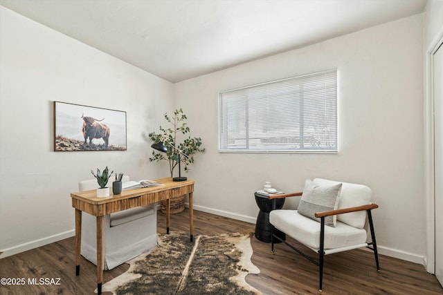 office area with dark wood finished floors and baseboards