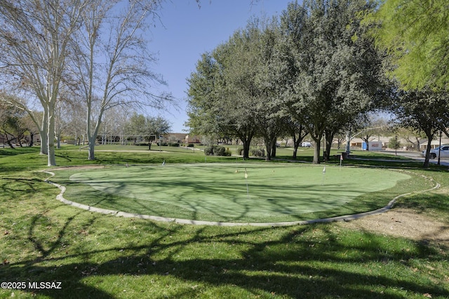 view of property's community with a lawn