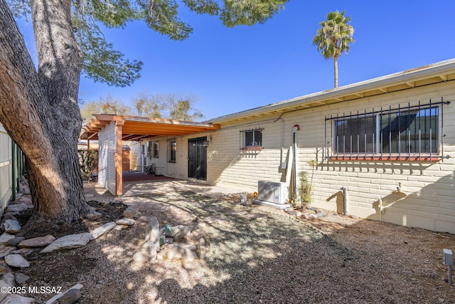 back of property with a patio