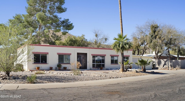 view of front of property with a garage and concrete driveway