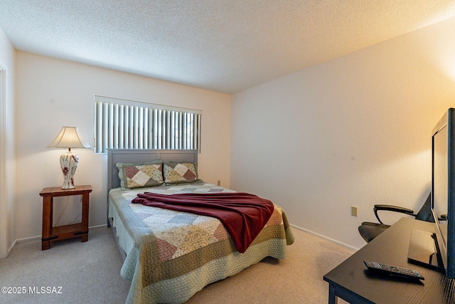 carpeted bedroom with a textured ceiling and baseboards