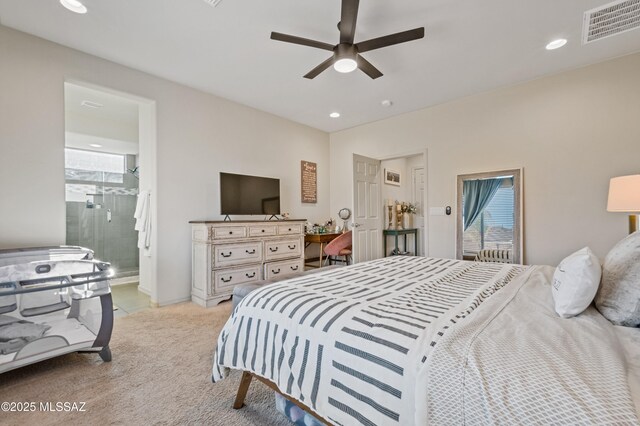 bedroom with light carpet, visible vents, connected bathroom, a ceiling fan, and recessed lighting