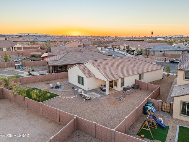 aerial view at dusk with a residential view