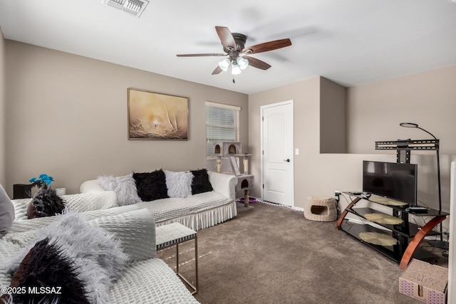 living area with a ceiling fan, carpet, and visible vents