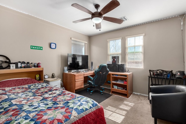 bedroom with visible vents, ceiling fan, and light carpet