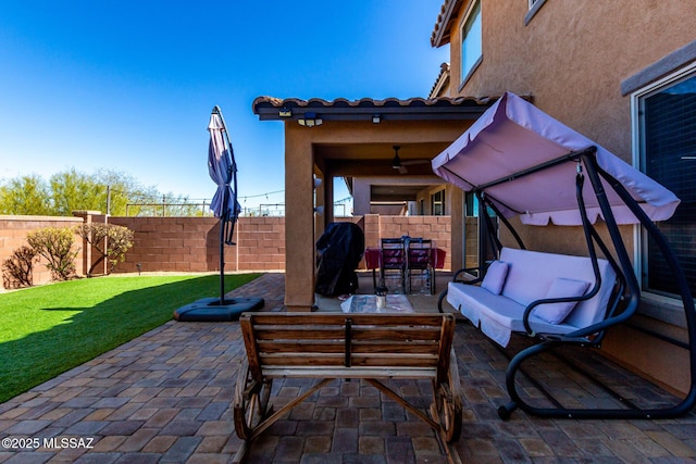 view of patio with a fenced backyard, an outdoor hangout area, and area for grilling