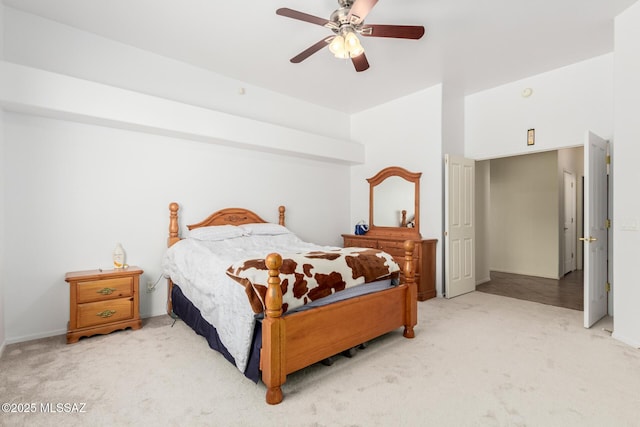 carpeted bedroom with a ceiling fan