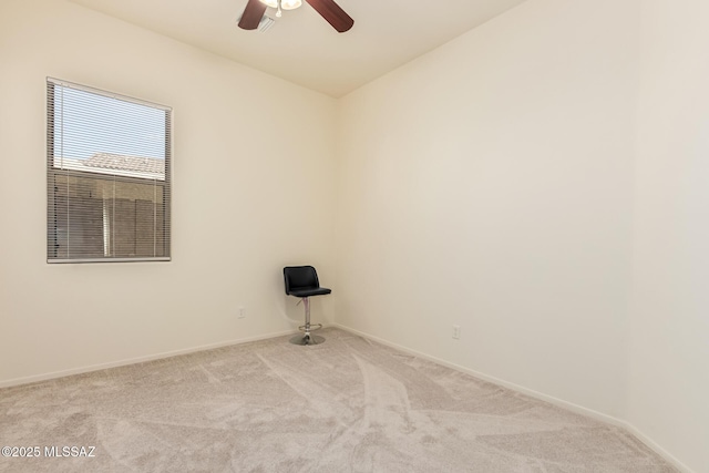 empty room with light carpet, ceiling fan, and baseboards