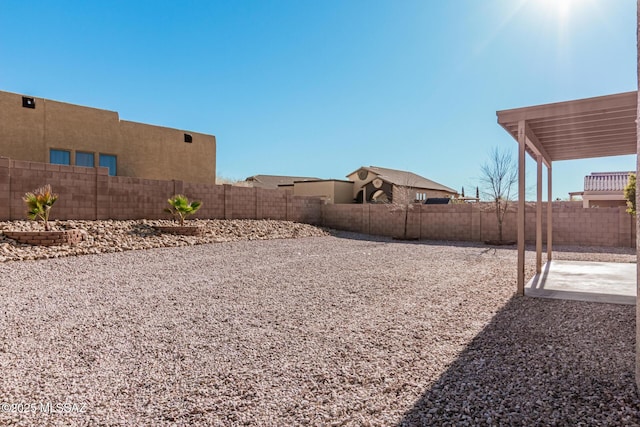 view of yard with a patio and a fenced backyard