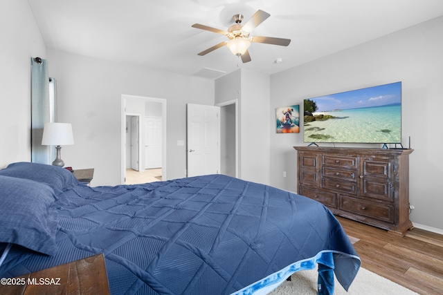 bedroom with light wood-style flooring, baseboards, and ceiling fan