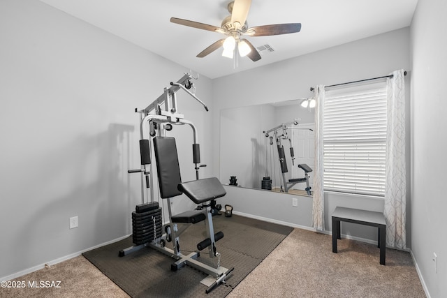 workout room featuring a ceiling fan, baseboards, visible vents, and carpet flooring