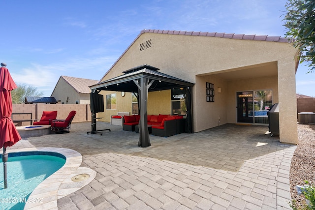 view of patio / terrace featuring an outdoor living space with a fire pit, a fenced in pool, and fence