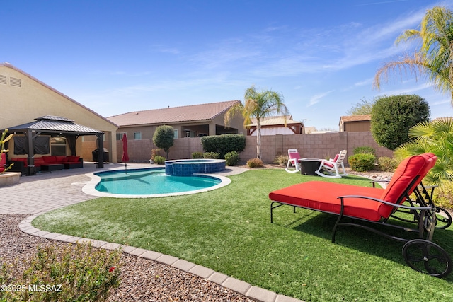 view of pool featuring a fenced backyard, a pool with connected hot tub, a gazebo, a lawn, and a patio area