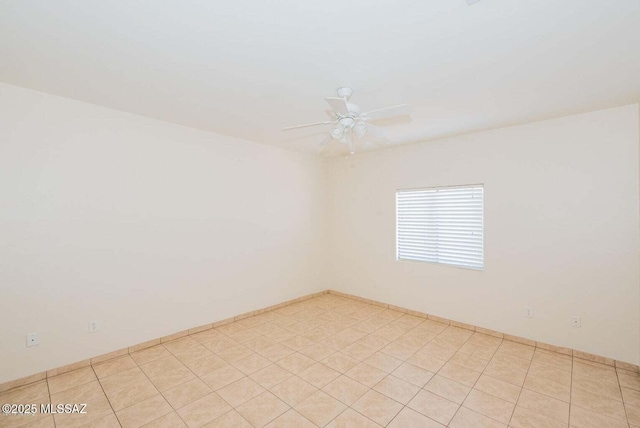 spare room featuring a ceiling fan