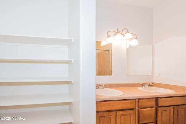 full bath featuring a sink, a shower, and double vanity