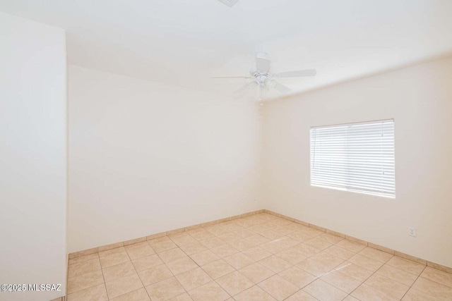 unfurnished room featuring baseboards and ceiling fan