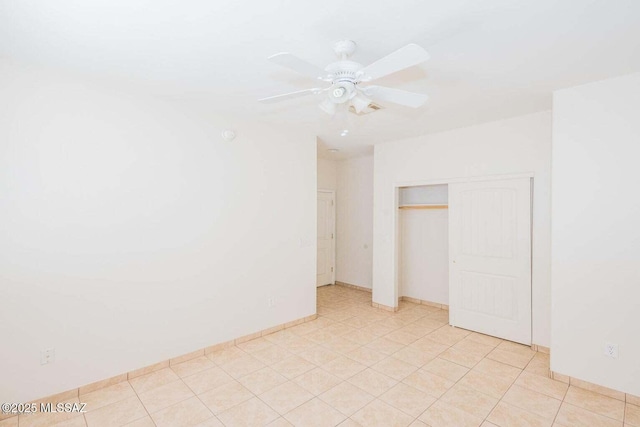 unfurnished bedroom with light tile patterned floors, a closet, visible vents, and a ceiling fan