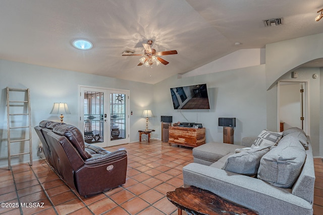 living room with visible vents, ceiling fan, arched walkways, lofted ceiling, and french doors