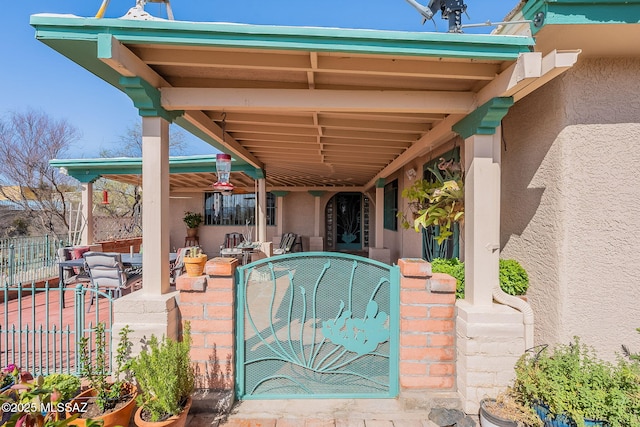 exterior space with fence and outdoor dining space
