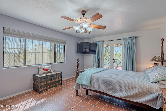 bedroom with french doors, multiple windows, baseboards, and access to exterior