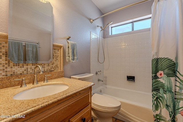 bathroom with toilet, vanity, shower / tub combo, a textured wall, and backsplash