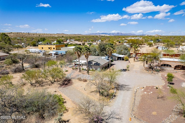 aerial view featuring a mountain view and view of desert