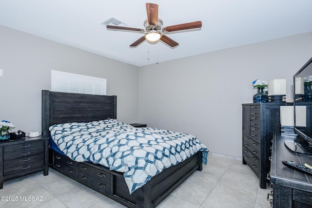 bedroom featuring visible vents, ceiling fan, and light tile patterned floors