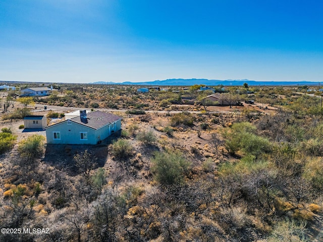 birds eye view of property featuring a mountain view