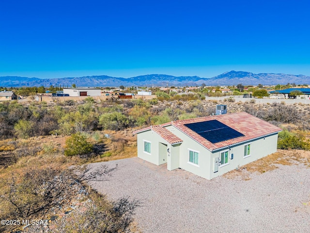 birds eye view of property with a mountain view