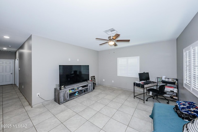 office area featuring ceiling fan, light tile patterned flooring, and visible vents