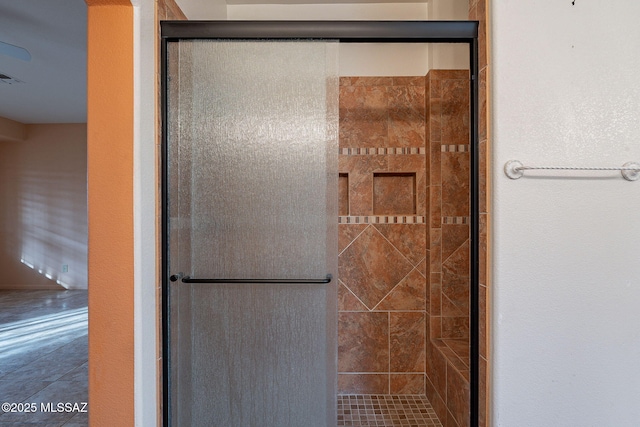 full bath with visible vents and a shower stall