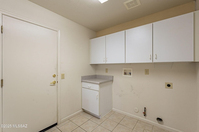 laundry area featuring visible vents, gas dryer hookup, light tile patterned floors, hookup for an electric dryer, and hookup for a washing machine