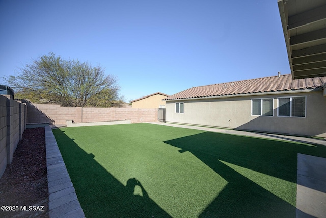 view of yard with a fenced backyard