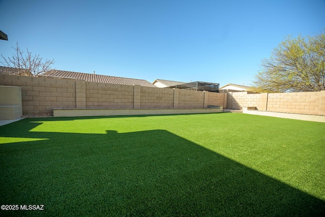 view of yard featuring a fenced backyard