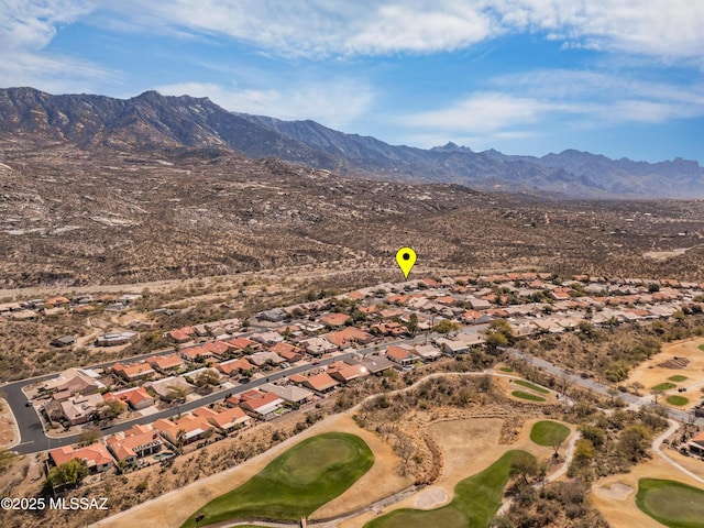 birds eye view of property with view of golf course, a residential view, and a mountain view