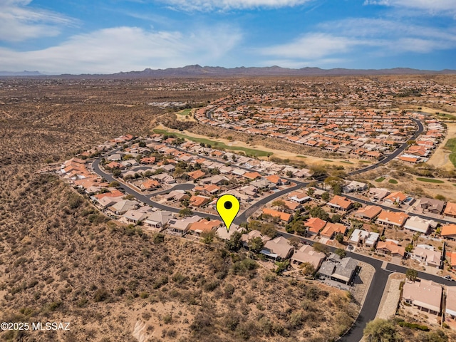 drone / aerial view featuring a residential view and a mountain view