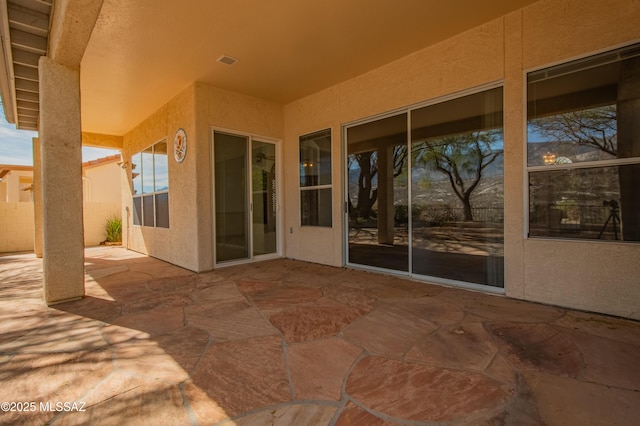 view of patio / terrace featuring visible vents