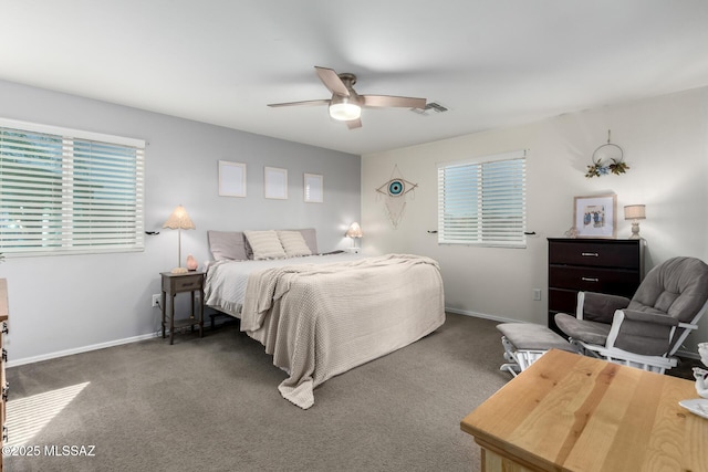 bedroom featuring baseboards, visible vents, and dark carpet