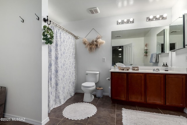 bathroom with toilet, visible vents, baseboards, tile patterned floors, and double vanity