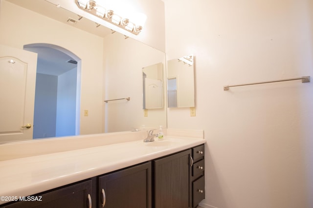 bathroom with visible vents and vanity