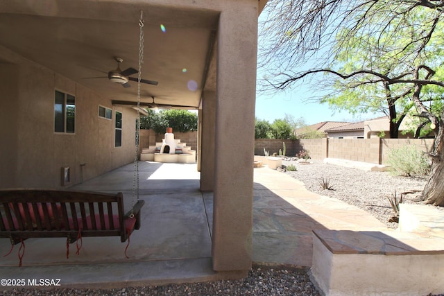 view of patio featuring a fenced backyard and ceiling fan