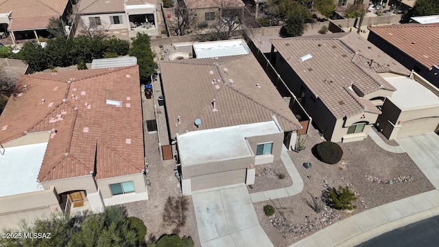 birds eye view of property with a residential view