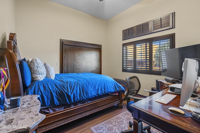 bedroom with wood finished floors