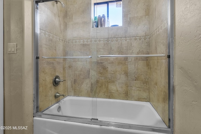 full bath with combined bath / shower with glass door