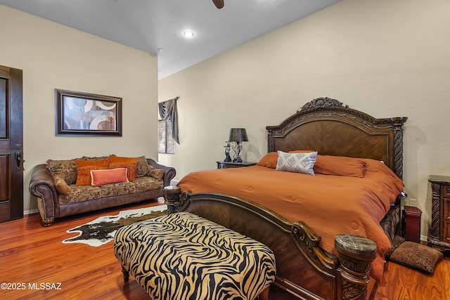 bedroom with wood finished floors, a ceiling fan, and recessed lighting